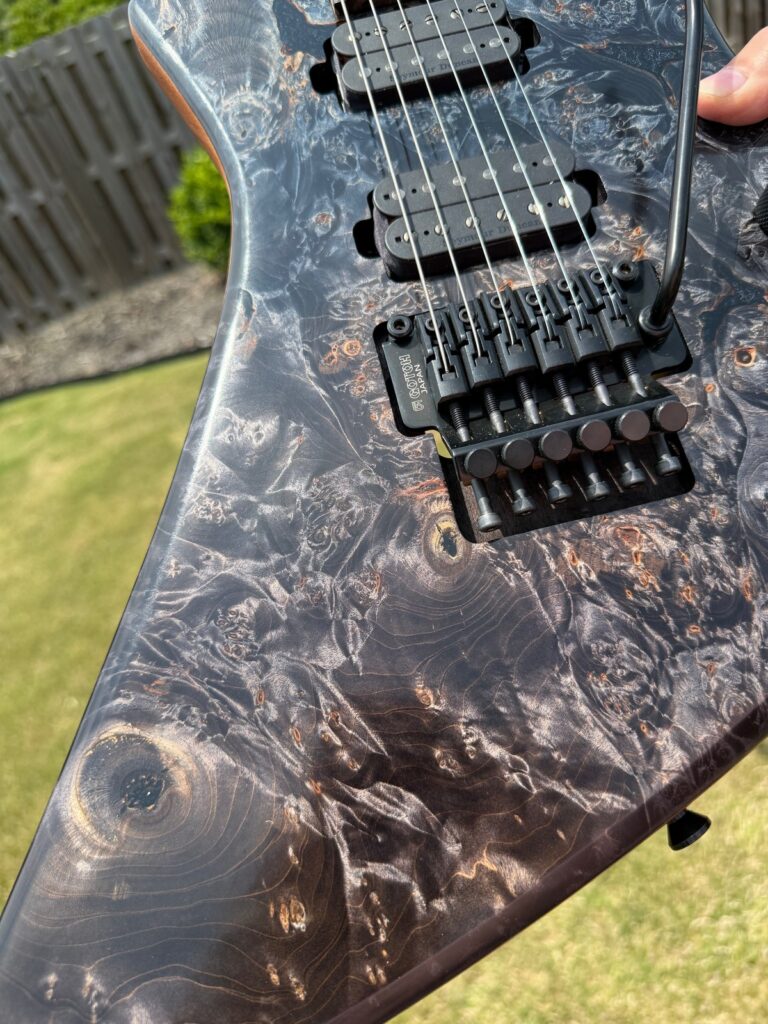 Black burl top wood detail on a T.W. Smith Arch 6 guitar