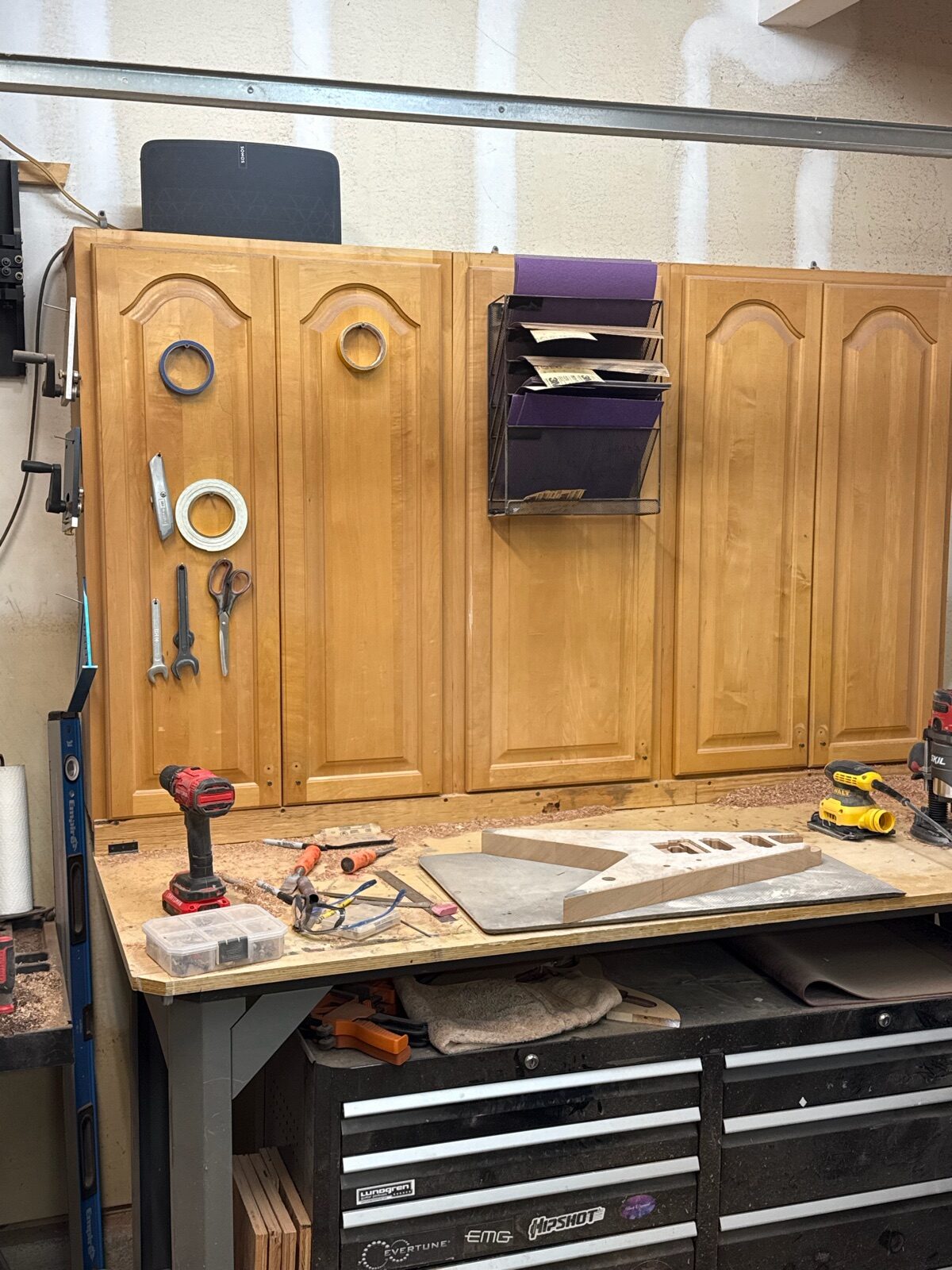 T.W. Smith guitar parts and necks laid out on the workbench