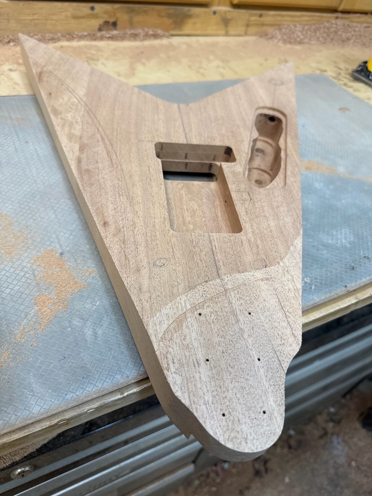 Raw maple guitar body blank being shaped in the T.W. Smith shop
