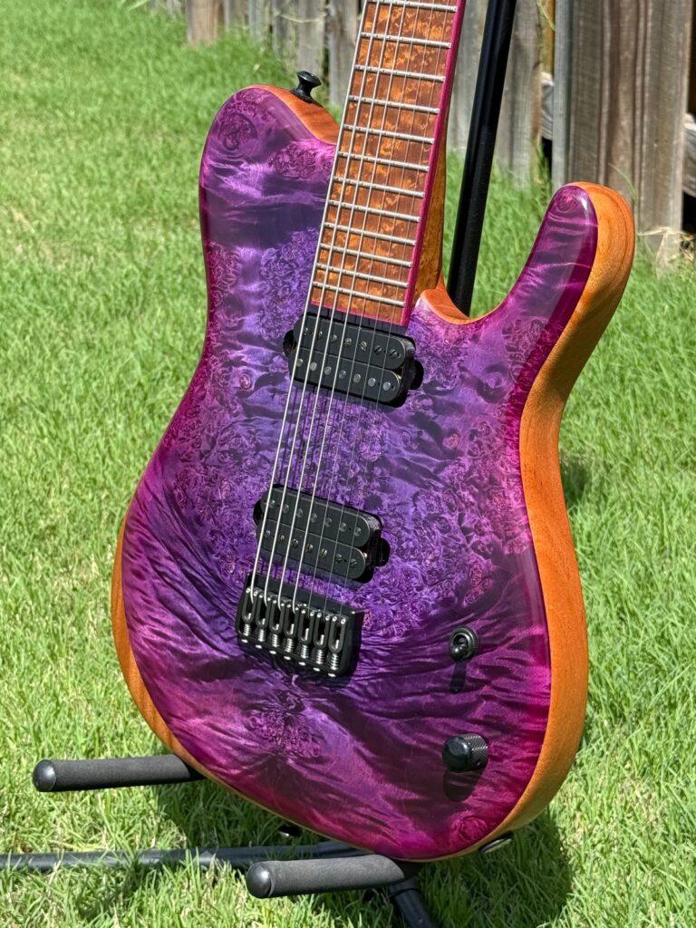 Purple burl top detail on a T.W. Smith Talia 7 guitar