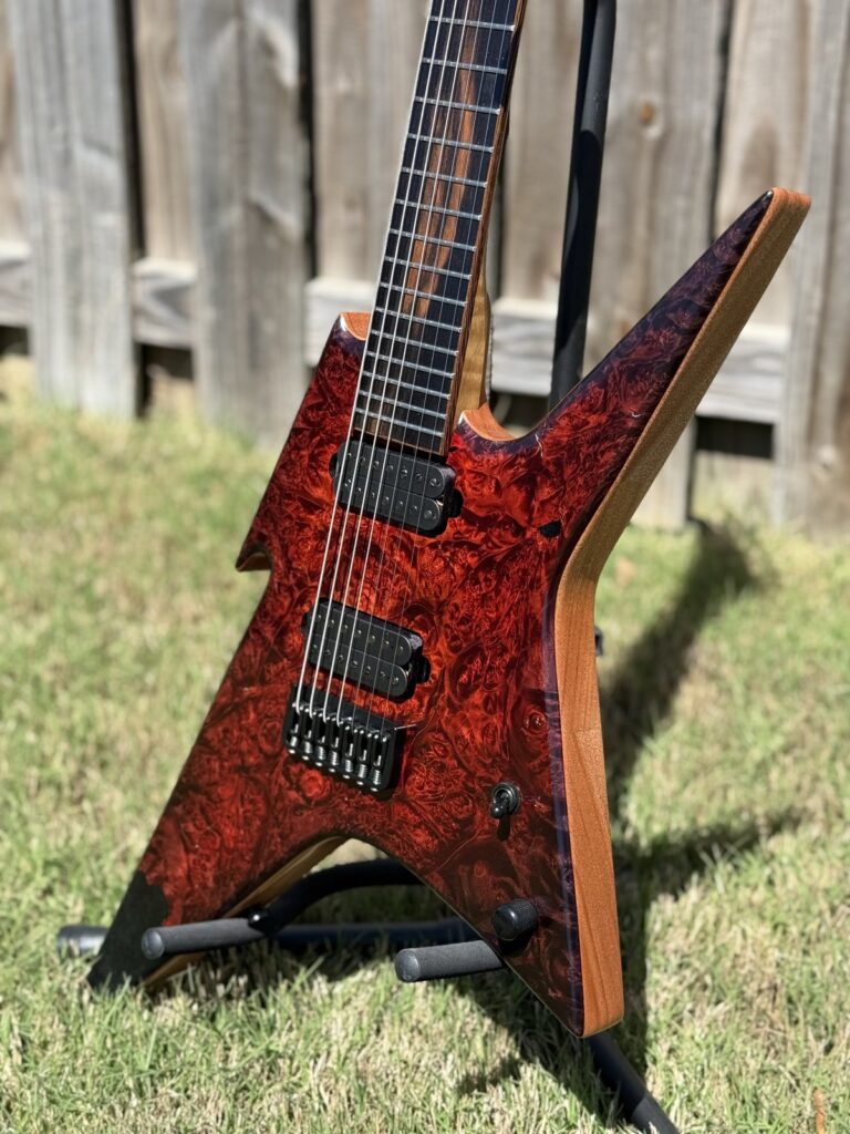 T.W. Smith Vulture 7 seven-string guitar with red-orange burl top