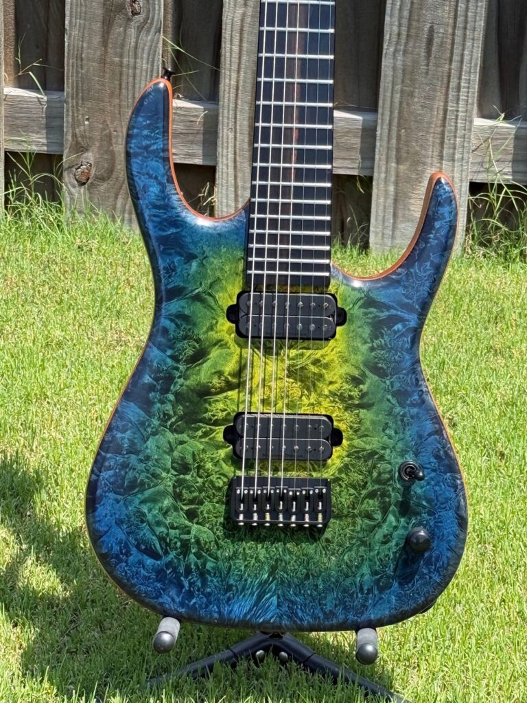 T.W. Smith Apex 7 custom guitar with yellow, green and blue burl top