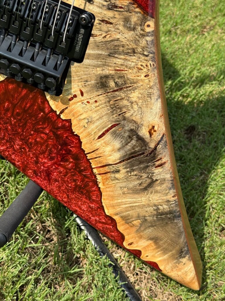 Buckeye burl and crimson epoxy top detail on a left-handed T.W. Smith Arch 6 guitar