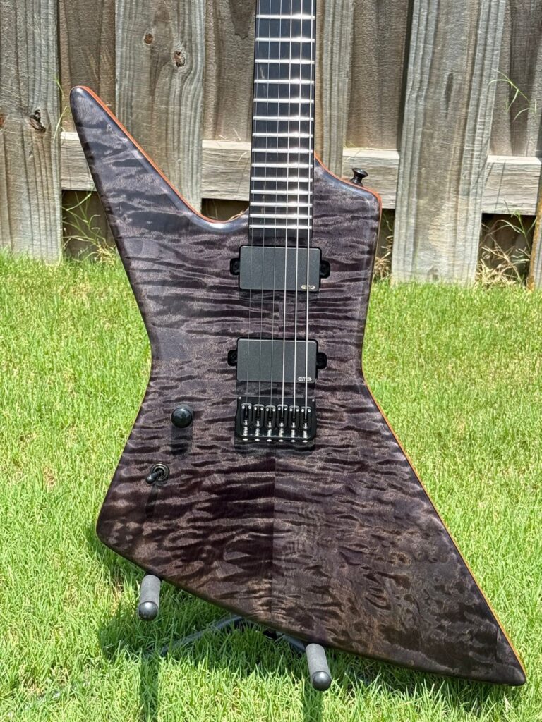 Left-handed T.W. Smith Challenger 6 custom guitar with black flame top