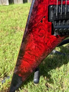 T.W. Smith Vulture 7 red burl custom guitar — maple burl and epoxy detail